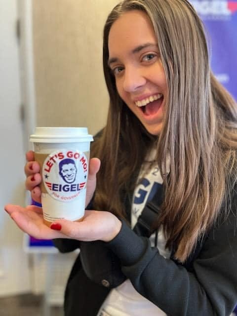 May be an image of 1 person, coffee cup and text