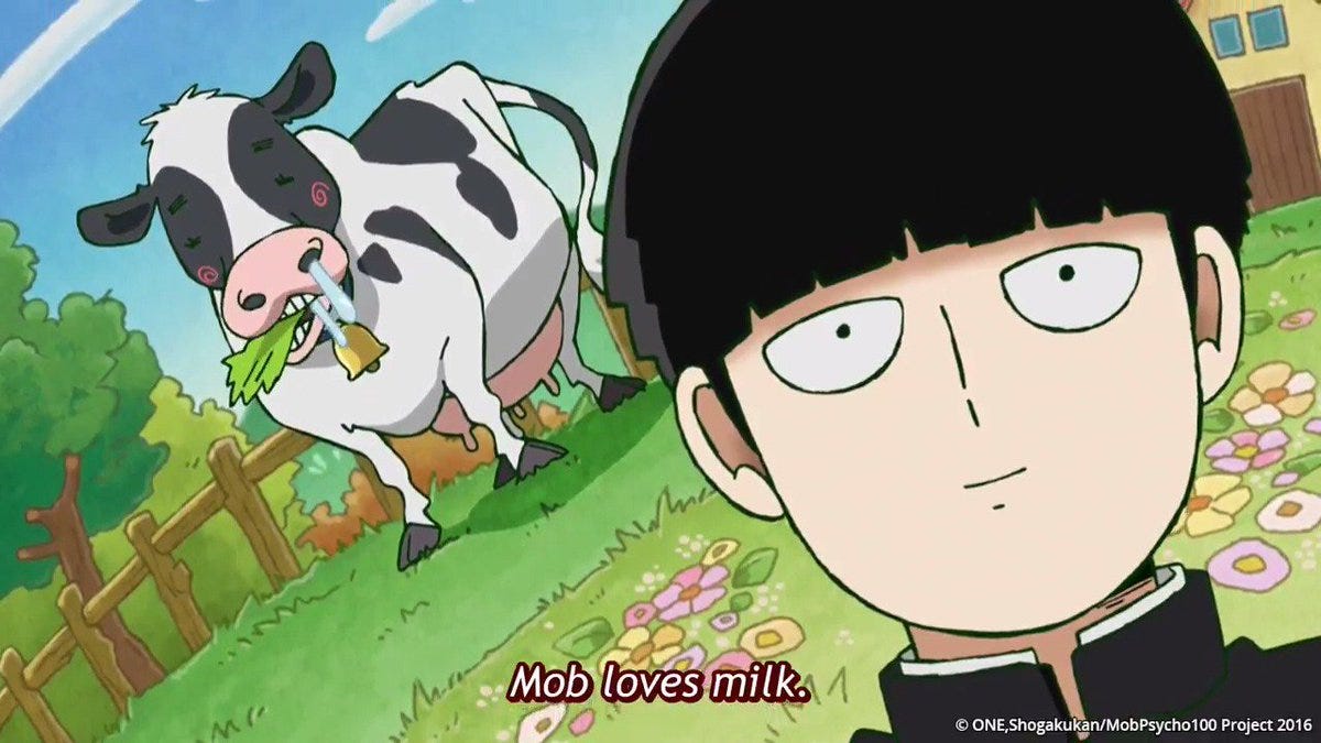 Mob is smiling while in the background there is a farm with a cow eating plants. Subtitles say "Mob loves milk."