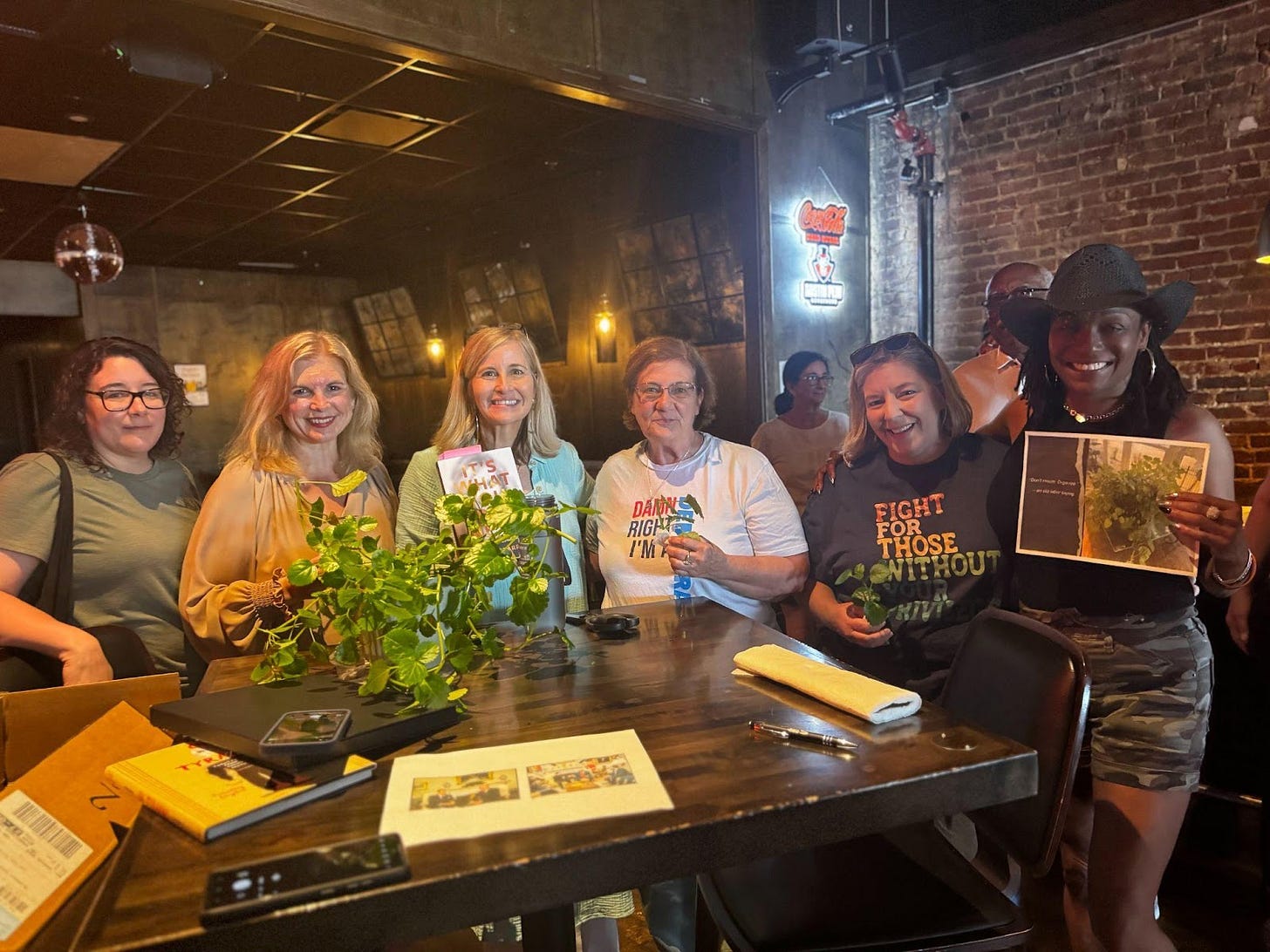 A group of people posing for a photo

Description automatically generated