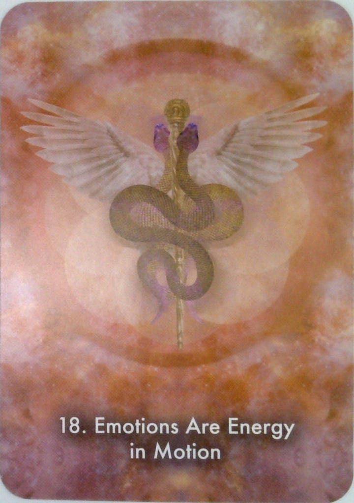 The Justice tarot card and the Emotions Are Energy in Motion oracle card.