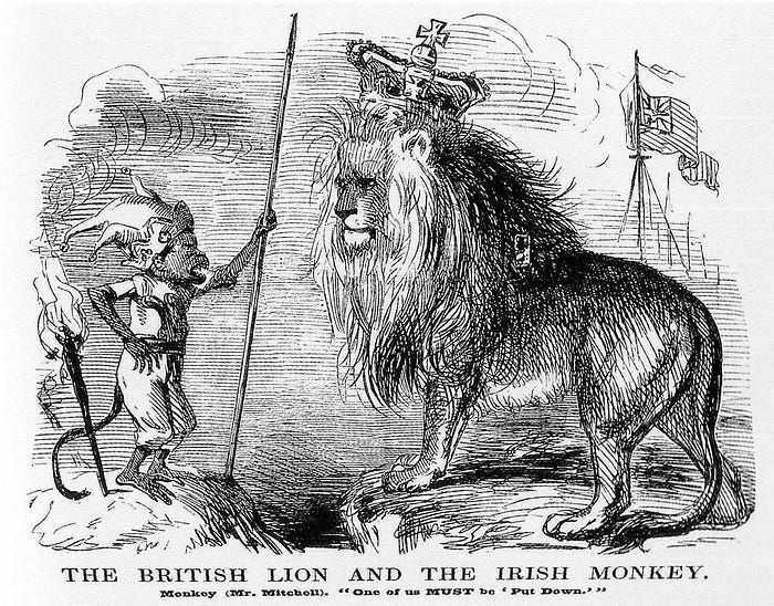 Cartoon captioned ‘The British Lion and the Irish Monkey’. Black and white drawing of a monkey wearing a jester’s hat and holding a speer (left) screeching at a large lion wearing a royal crown (right), with flags in the background. Cartoon captioned ‘The British Lion and the Irish Monkey’. Black and white drawing of a monkey wearing a jester’s hat and holding a speer (left) screeching at a large lion wearing a royal crown (right), with flags in the background.