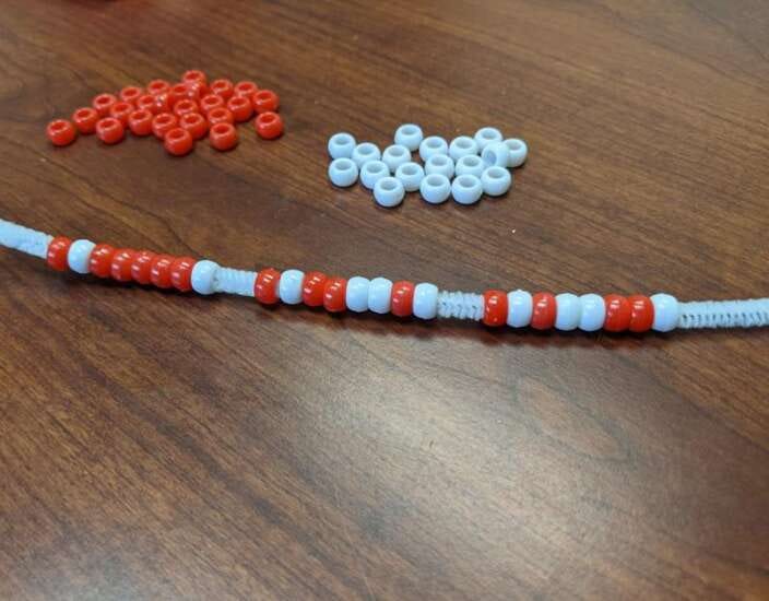Code your own name in binary and turn it into a bracelet