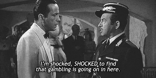a black and white photo of two men with the caption i 'm shocked shocked to find that gambling is going on a black and white photo of two men with the caption i 'm shocked shocked to find that gambling is going on