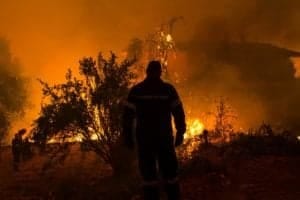 Firefighter amid fire