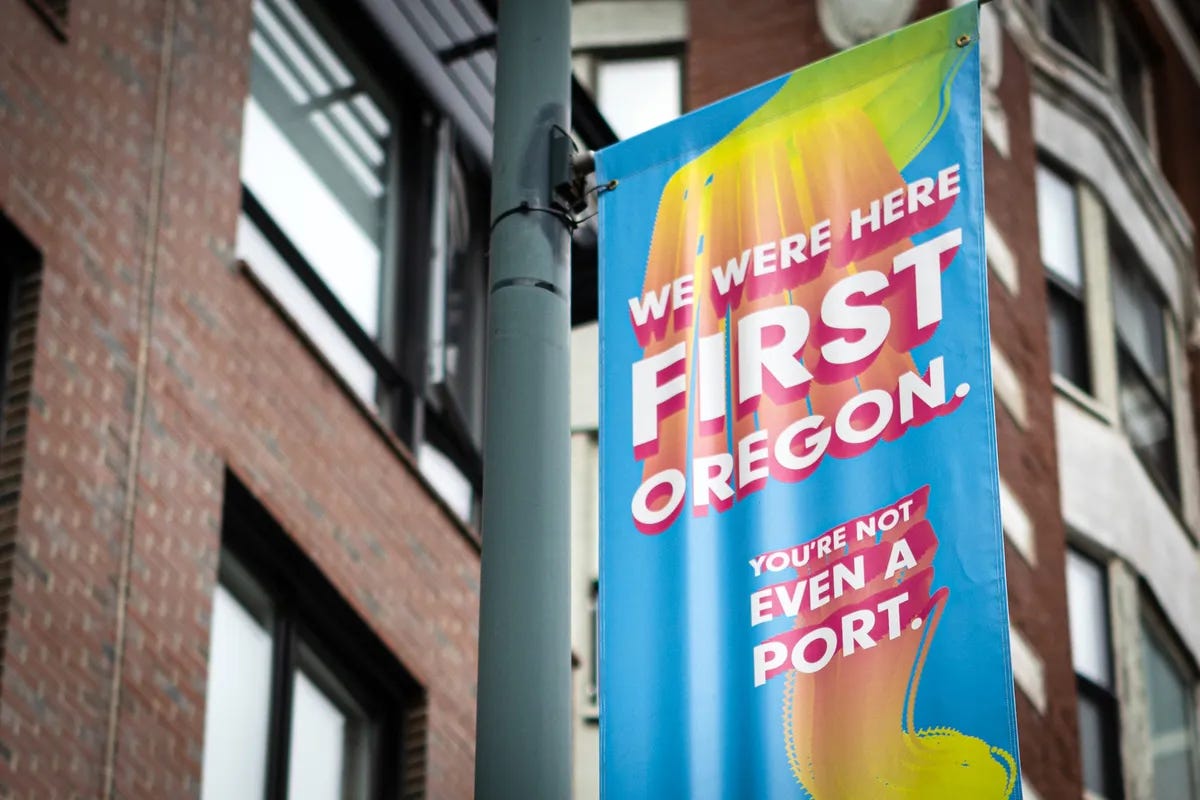 Street Banner in Portland, Main that reads "We were here first Oregon. You're not even a port." Street Banner in Portland, Main that reads "We were here first Oregon. You're not even a port."