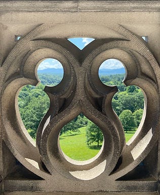 Landscape view through the stonework at the edge of the Veranda at Biltmore House
