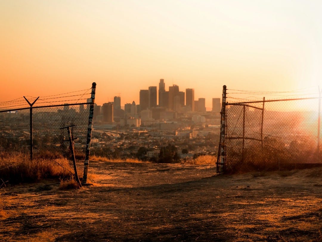 black metal fence near building during daytime