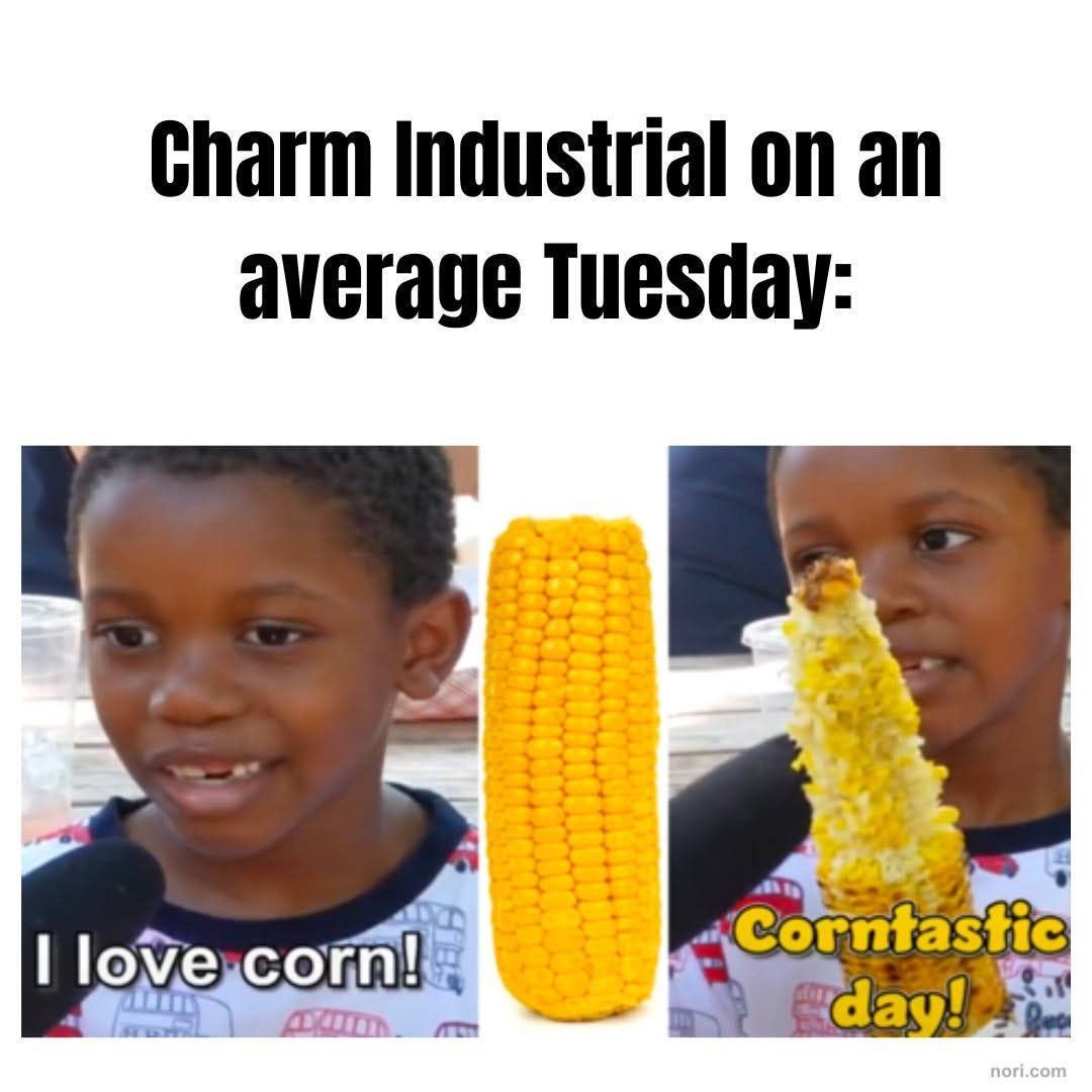 The corn kid meme under the text "Charm Industrial on an average Tuesday:". A boy says "I love corn!" beside an ear of corn, then holds a half-eaten cob: "Corntastic day!"