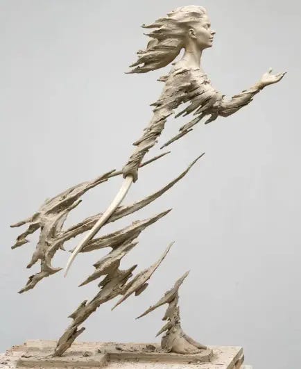 The sculpture depicts a woman moving forward through a fierce, weathering storm. Her disintegrating, fragmented lower body suggests limits being reached and pushed beyond breaking. The sculpture depicts a woman moving forward through a fierce, weathering storm. Her disintegrating, fragmented lower body suggests limits being reached and pushed beyond breaking.