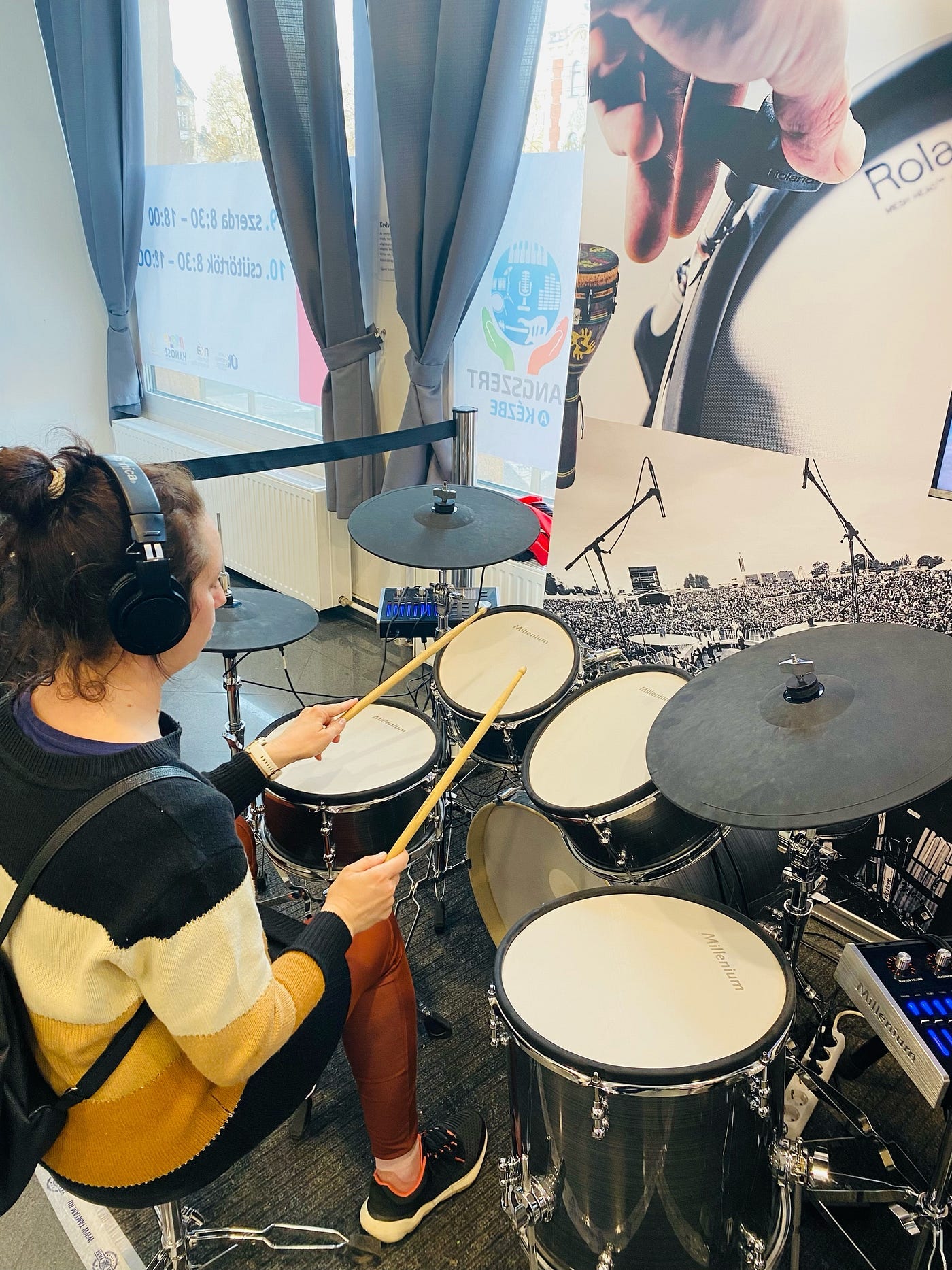 Me trying the drums! Wow, what an experience! — Photo taken by hubby with my phone.