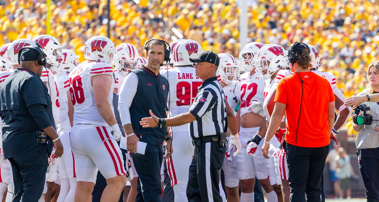 Luke Fickell and Wisconsin players standing on the sideline during a road game against Michigan at the Big House in Ann Arbor. Luke Fickell and Wisconsin players standing on the sideline during a road game against Michigan at the Big House in Ann Arbor.