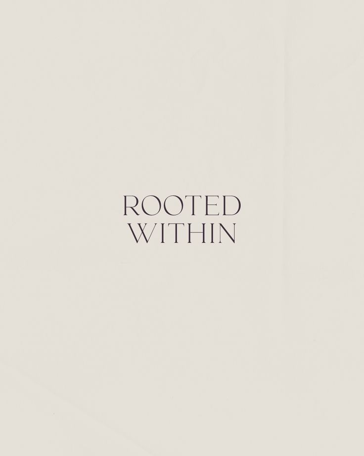 This may contain: a white wall with the words rooted within it