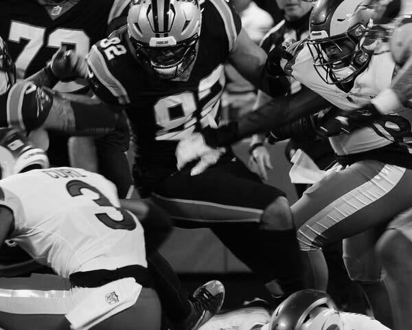 N.F.L. players jostling for position. 