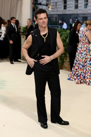 Image may contain Andrew Scott Clothing Formal Wear Suit Adult Person Accessories Jewelry Necklace and Footwear