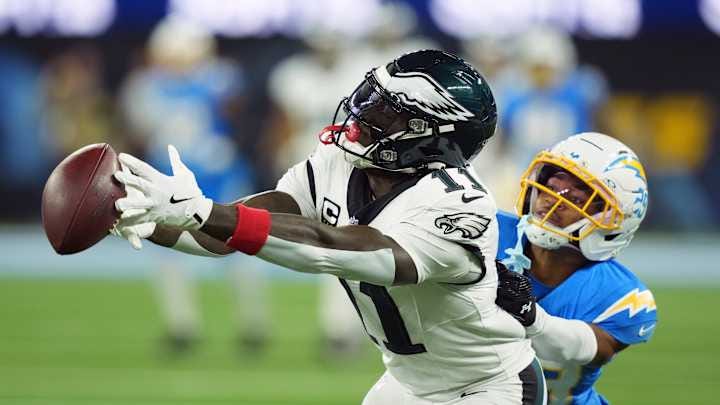 Dec 8, 2025; Inglewood, California, USA; Philadelphia Eagles wide receiver A.J. Brown (11) cannot make a catch against Los Angeles Chargers cornerback Tarheeb Still (29) at SoFi Stadium. Mandatory Credit: Kirby Lee-Imagn Images