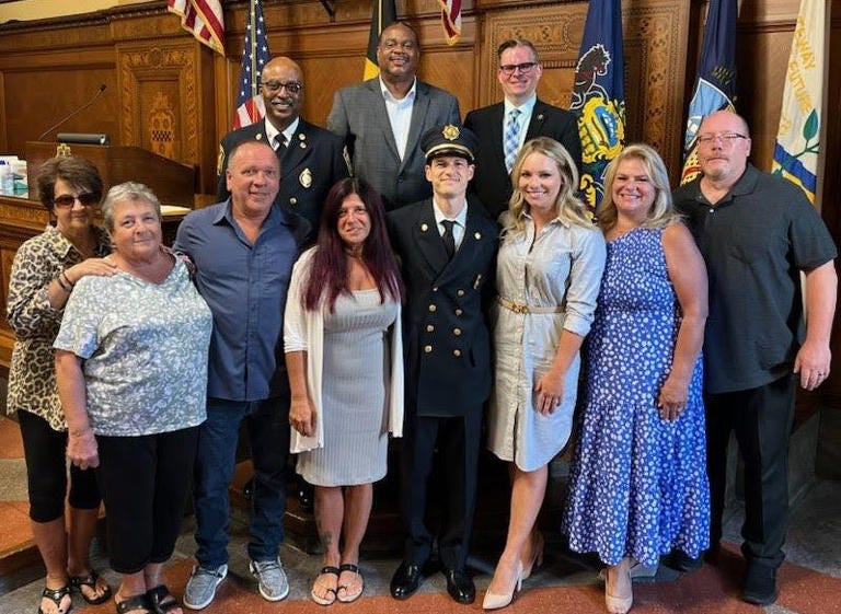 Lieutenant Randolph “Randy” Meyer, II with his family and Mayor Ed Gainey