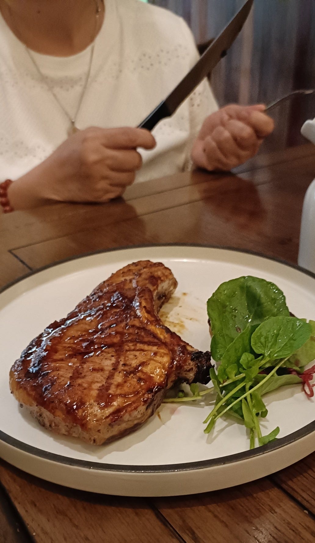 a plate of grilled pork chop