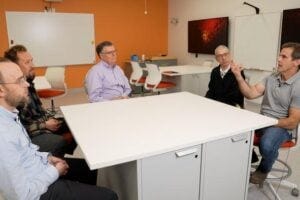 Researchers talking amongst each other