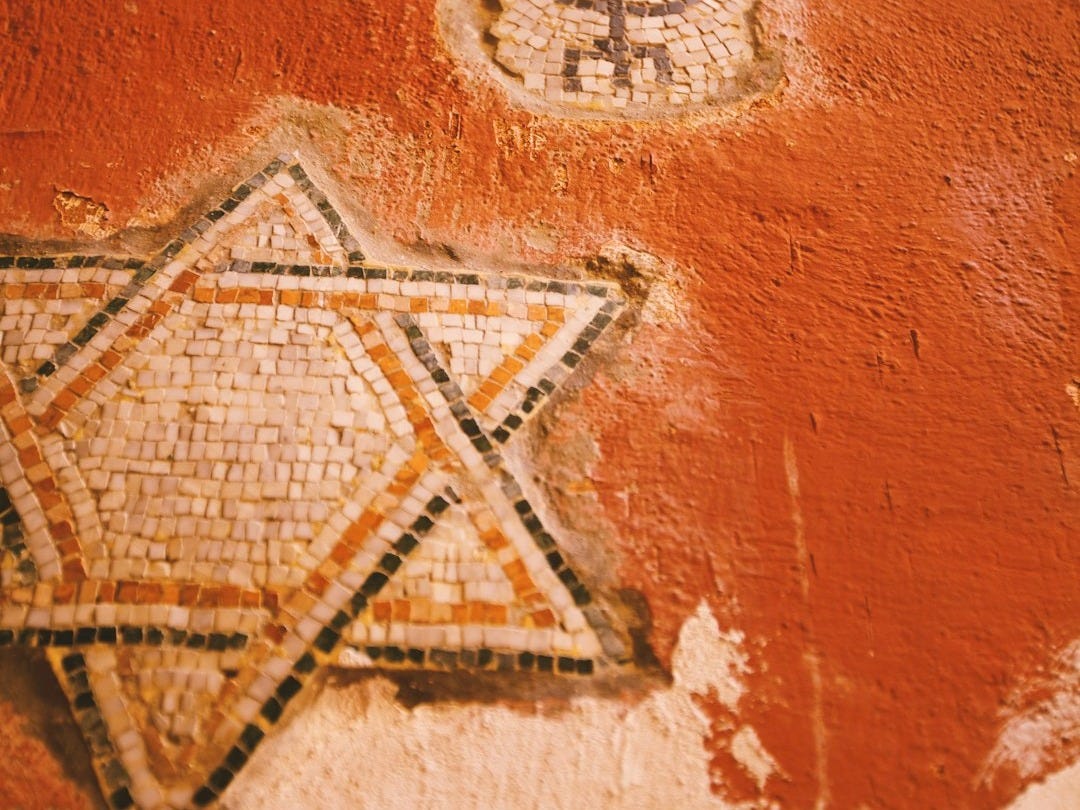 a picture of a star of david on a wall