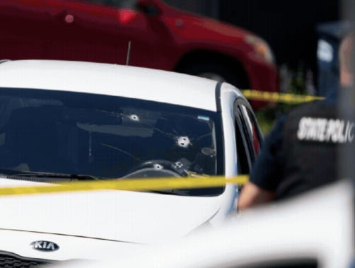 At least four bullet holes are clearly visible on the driver’s side windshield of the victim’s KIA following an ICE shooting in  Biddeford, Maine, on Monday, July 13, 2026. (Portland Press Herald photo)