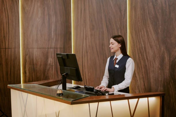 Hotel Worker Using Computer