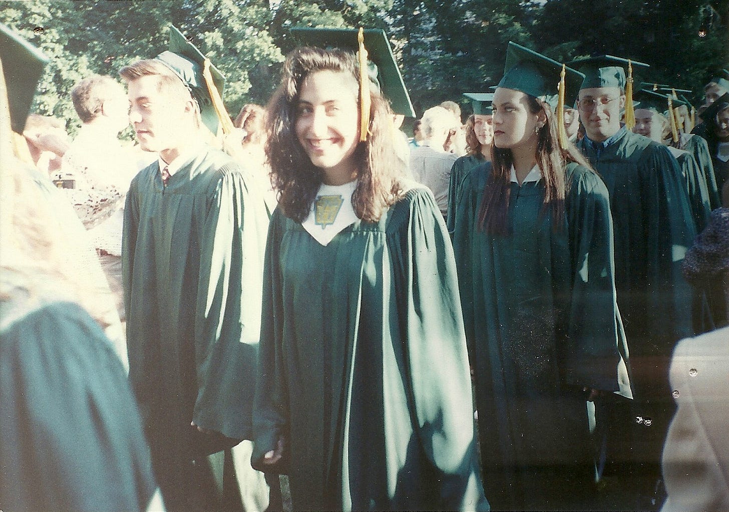 Photo of me in my cap and gown at my high school graduation