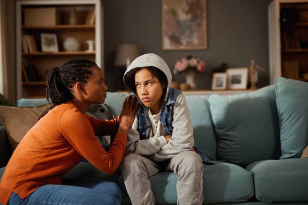 Mother and son talking about teenage problems at home Mother and son talking about teenage problems at home mother and son stock pictures, royalty-free photos & images