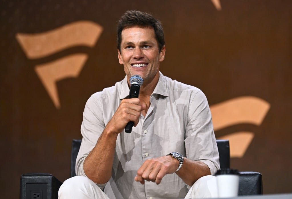 Tom Brady speaks at the Fanatics Fest NYC 2024 at Jacob Javits Center on August 16, 2024 in New York City.  
