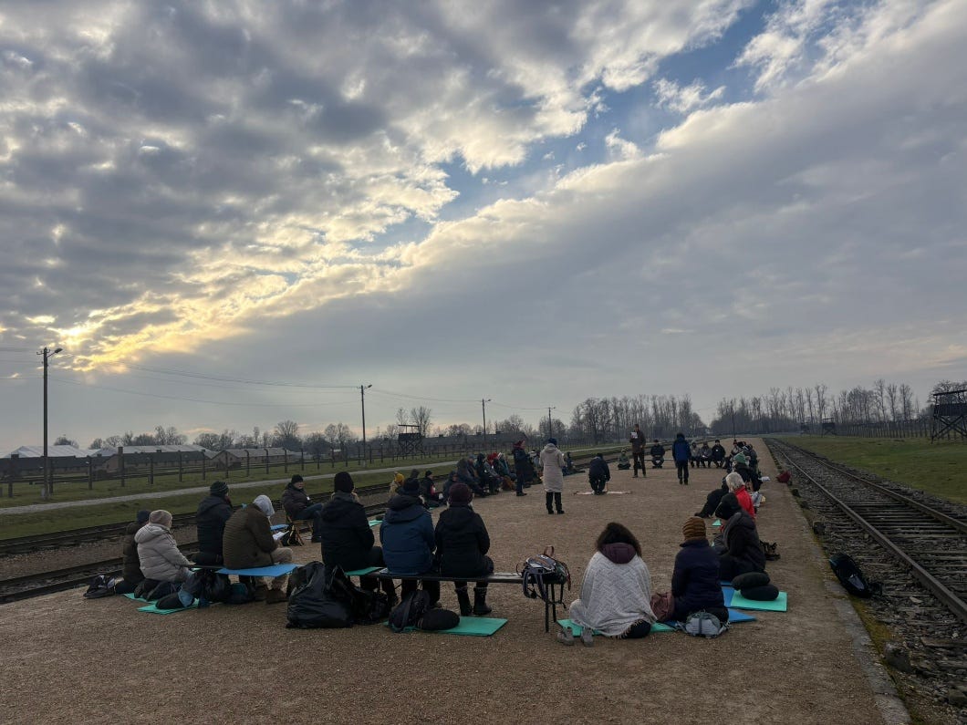 A group of people sitting on the ground
AI-generated content may be incorrect. A group of people sitting on the ground
AI-generated content may be incorrect.