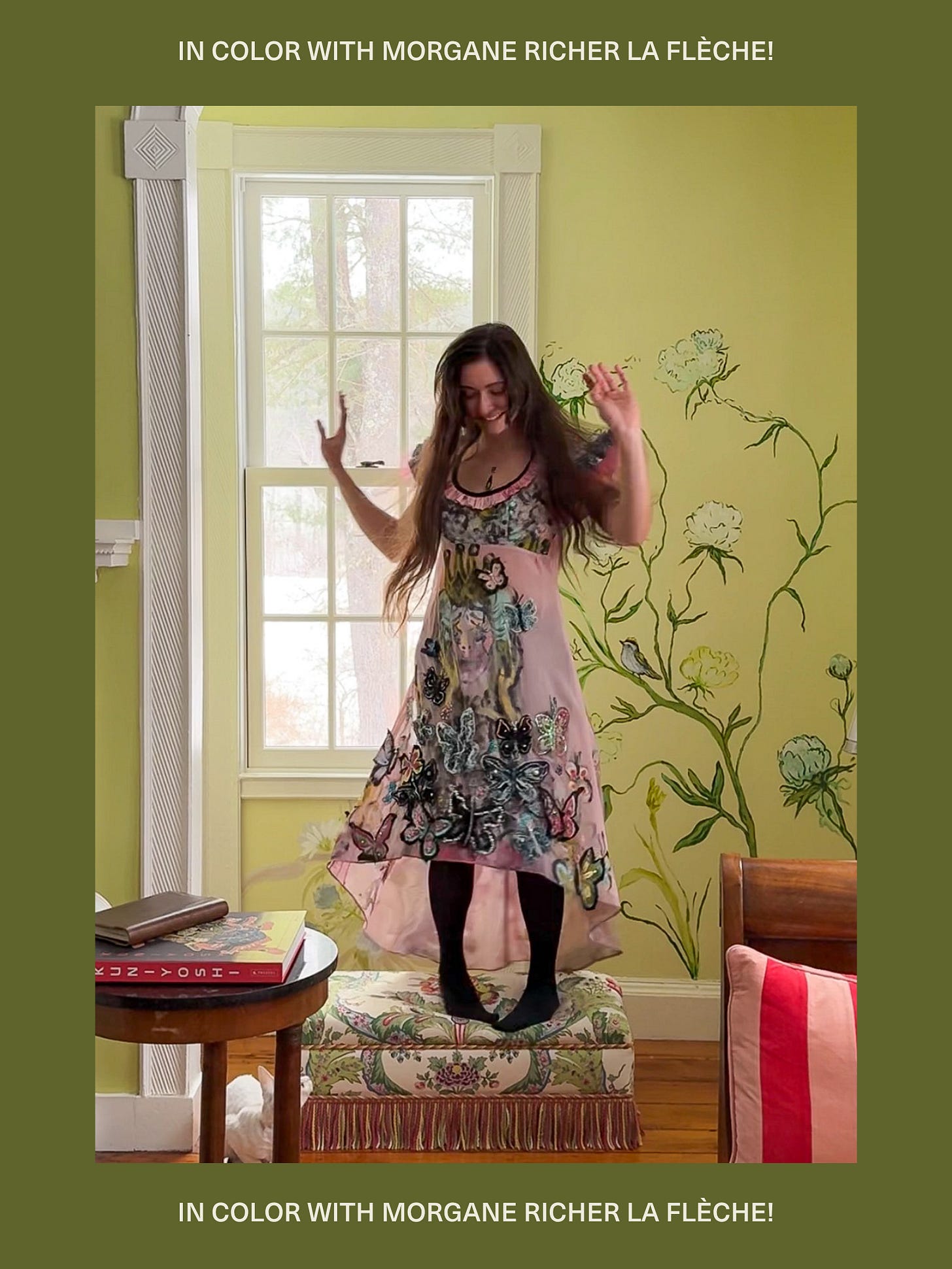 Girl in pink dress jumping on chair in green living room