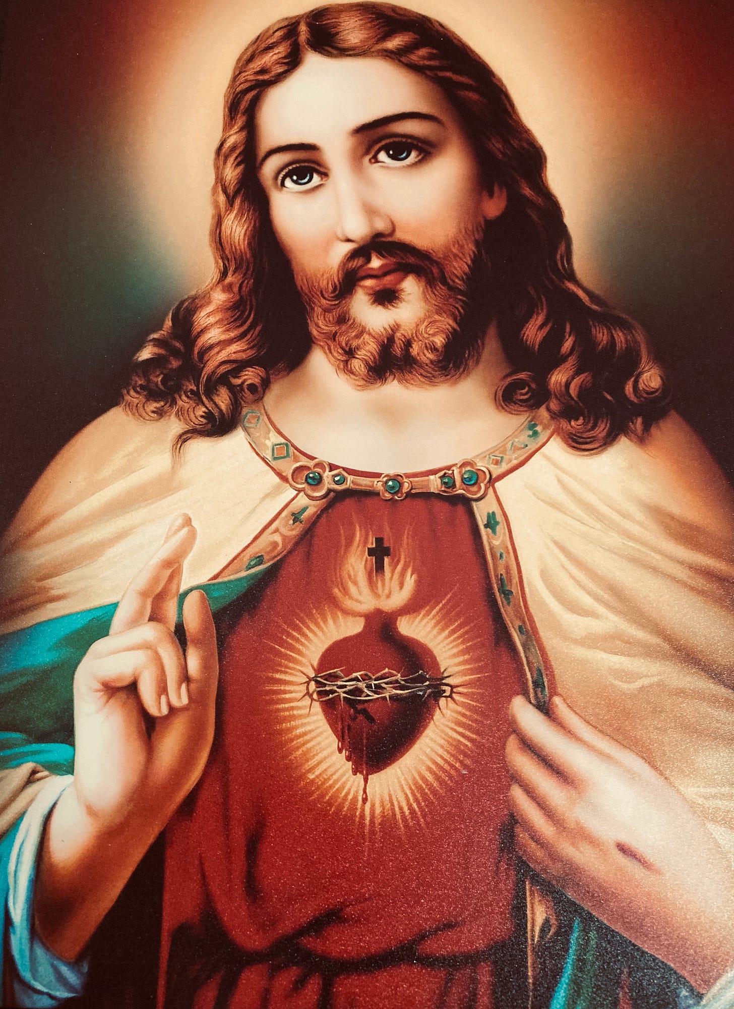 Why is the Sacred Heart of Jesus on fire?