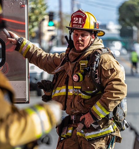 images of firemen working a fire in downtown LA's produce district