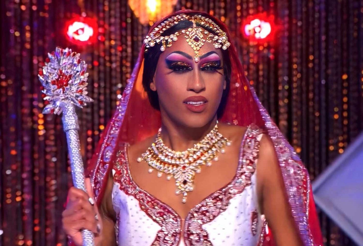 Priyanka holding the prize sceptre after winning Canada's Drag Race