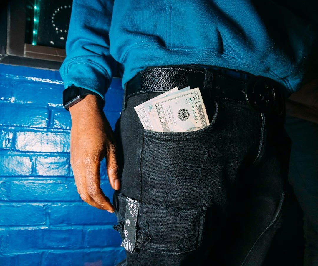 man in blue long sleeve shirt and black denim jeans man in blue long sleeve shirt and black denim jeans
