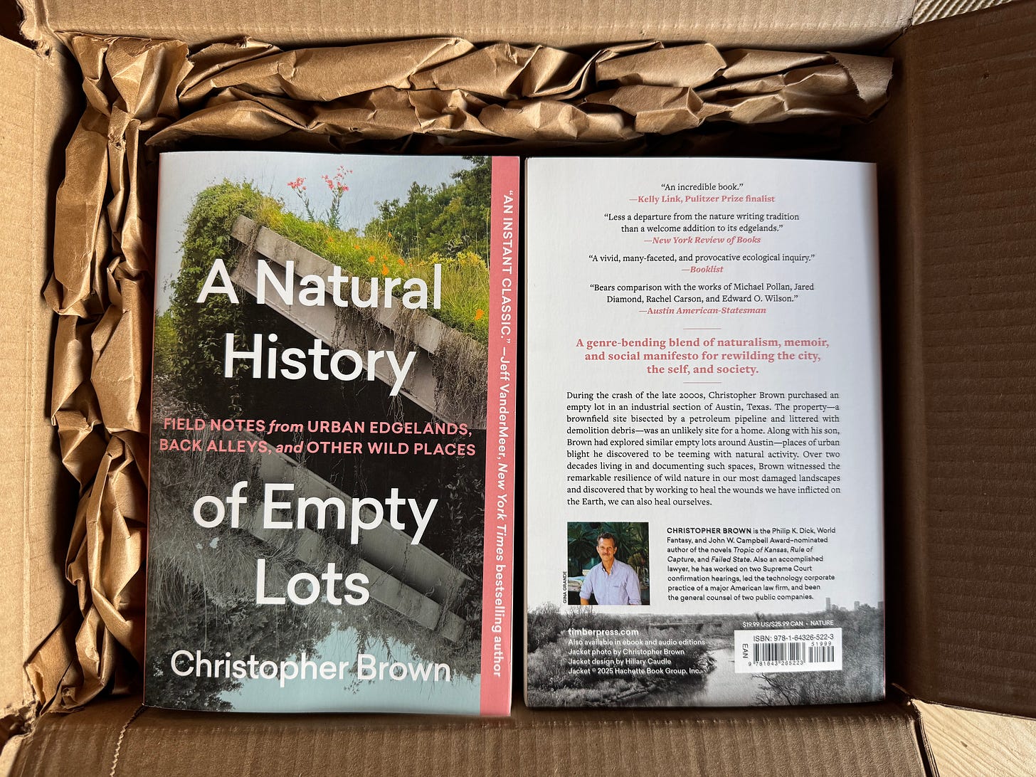 Paperback copies of A Natural History of Empty Lots