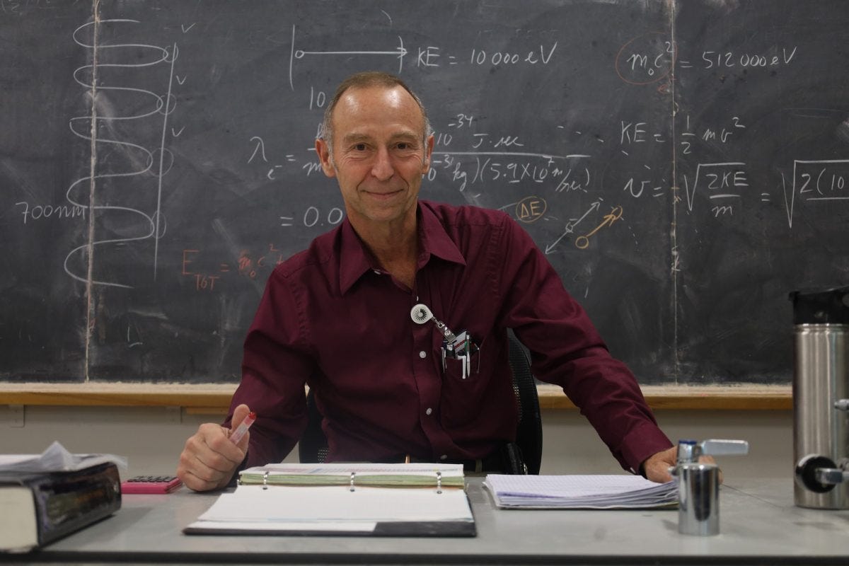 Michel Vvn Biezen, a professor of physics at El Camino College, sits in front of an equation Wednesday, May 28. His passion for teaching engineering and physics has led him to not only return to ECC to continue his pedagogic path, but also expand to online education through YouTube. His channel, "Michel van Viezen," has amassed over 1.1 million subscribers. (Drex Carratala | The Union)