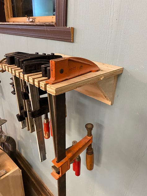 Wall-mounted clamp racks.