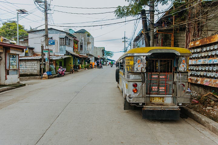 A bus on an urban street in the Philippines
