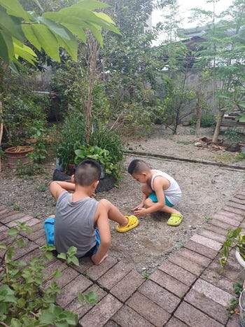 Miguel and Rafa playing in our backyard in San Antonio, Nueva Ecija