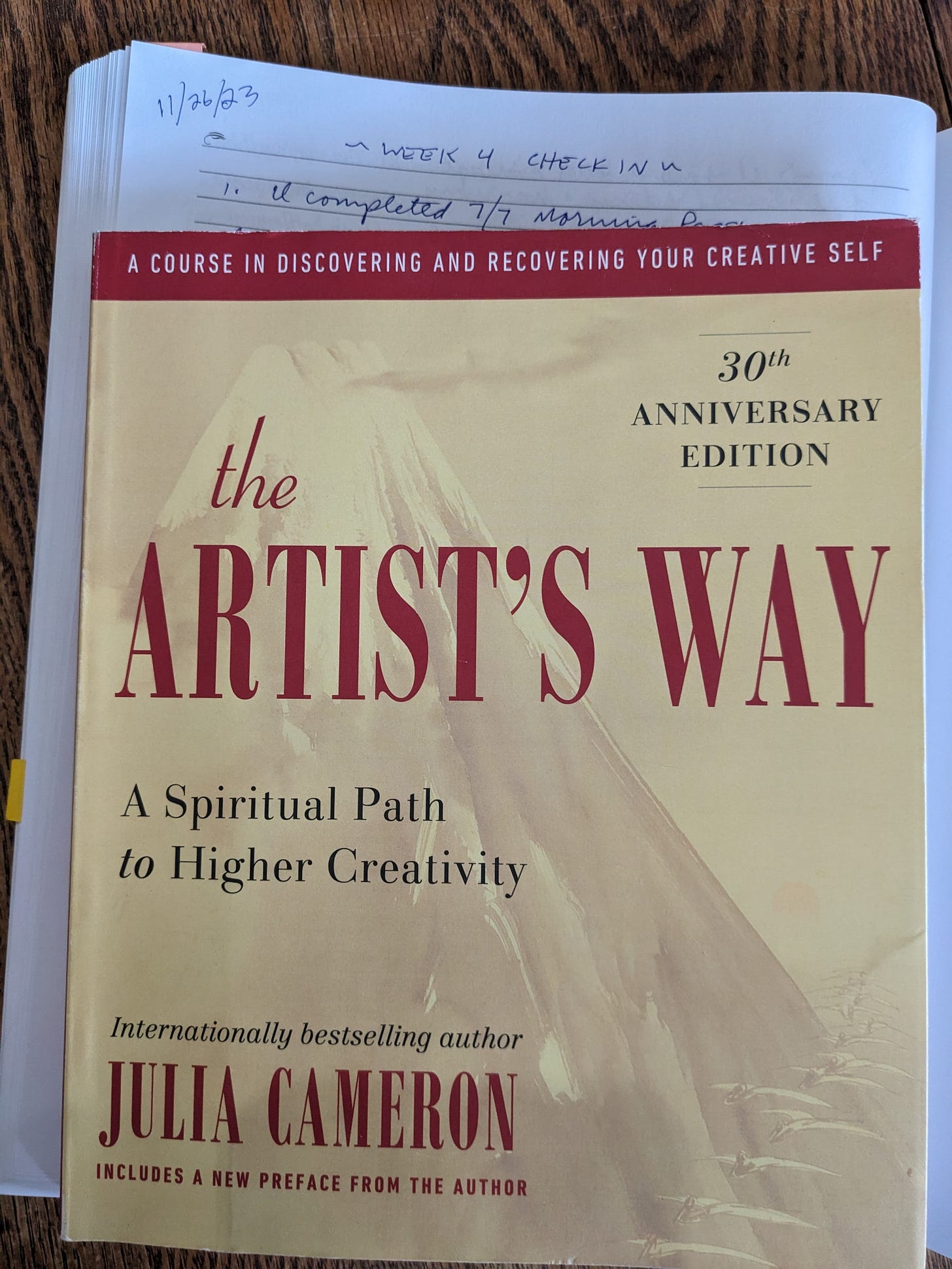 Image: Cover of The Artist’s Way, on top of my Morning Pages journal
