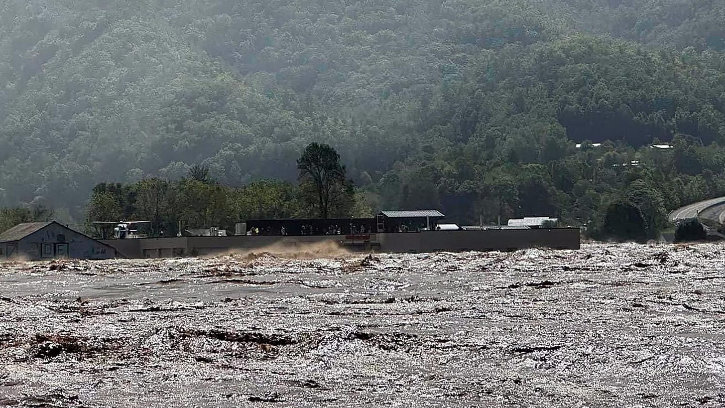People are rescued by helicopter from the roof of Unicoi County Hospital as it is surrounded by floodwaters in Erwin, Tenn, Sept. 27, 2024.