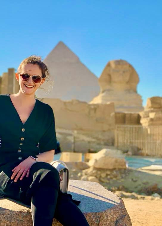 woman in Giza in front of the pyramids 