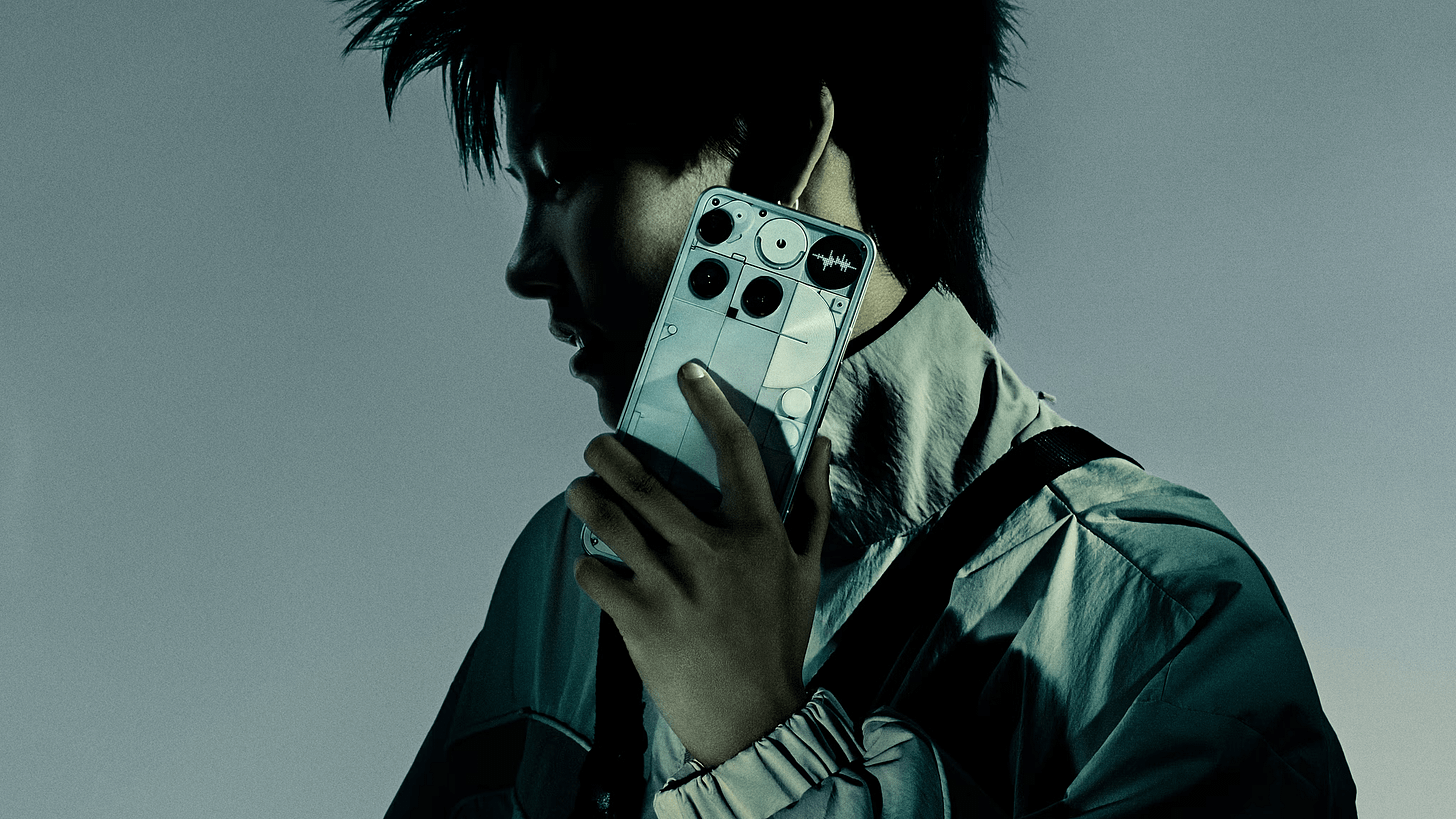 Professionally taken photo of a guy advertising the back of the Nothing Phone 3 with its asymmetrical camera positions and glyph matrix. 