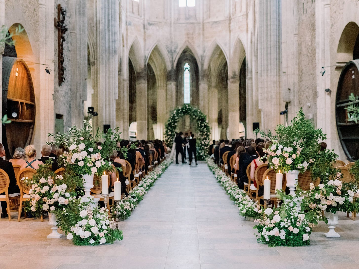 Luxurious Ceremony Aisle in Historic French Venue, White Flowers and Greenery, Verdant Arch Luxurious Ceremony Aisle in Historic French Venue, White Flowers and Greenery, Verdant Arch