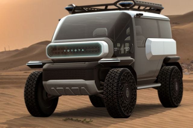 a toyota suv concept driving on a sandy road