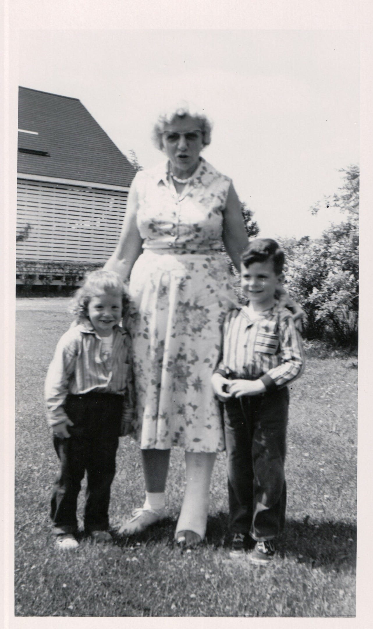 Aunt Babe (Wilma Scholbe) at Scholbe’s Cackle Farm after breaking her leg by failing down into the well in the egg house. She’s standing with me (age 3) and my brother Jarrett (age 5).
