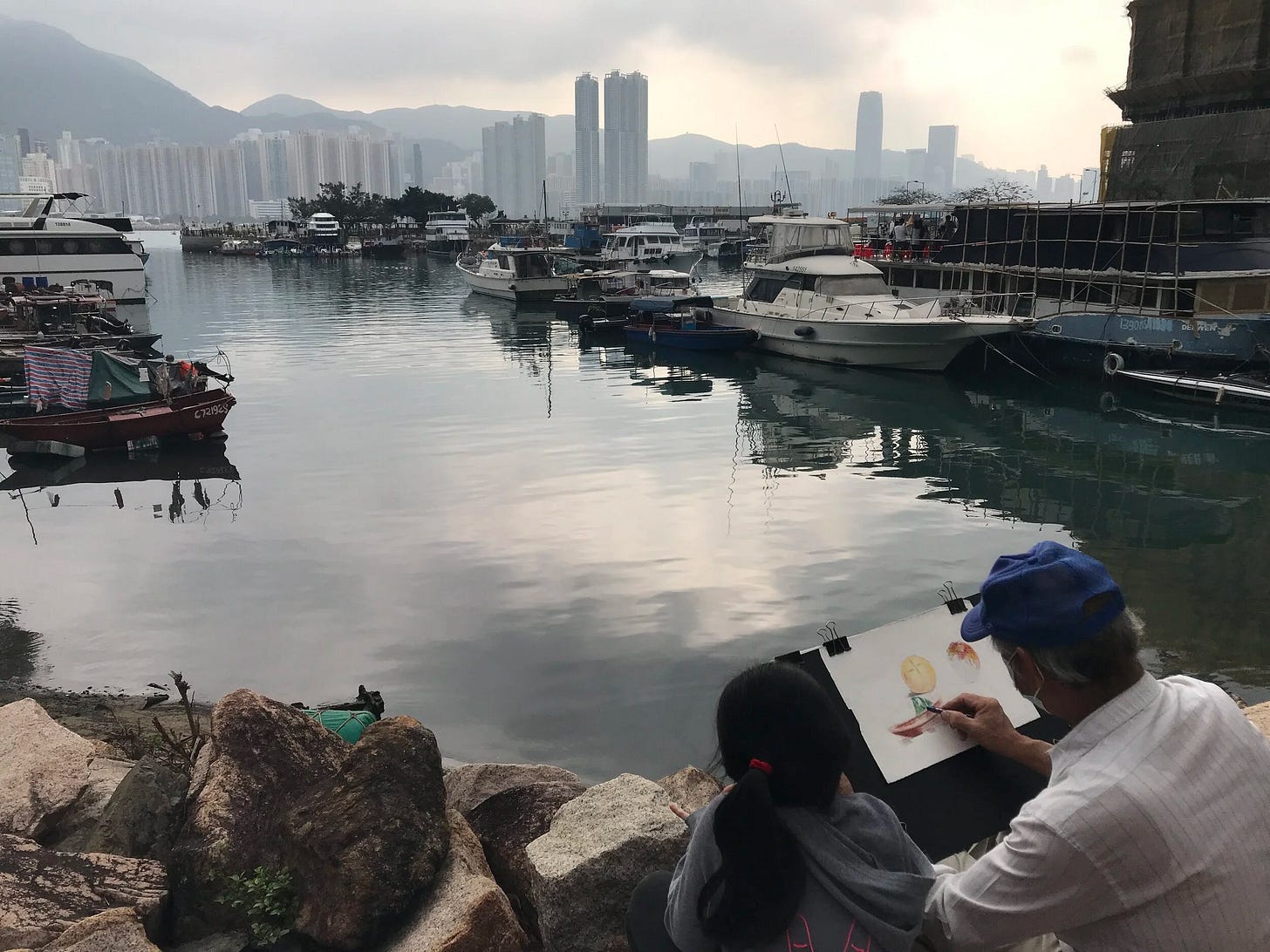  A young girl and grandpa sketching at Sam Tsuen Typhoon Shelter 
