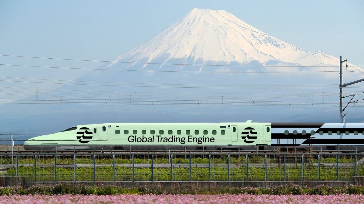 A green high-speed train with white accents and circular logos on its side displaying the text Global Trading Engine in white letters positioned on railway tracks surrounded by a chain-link fence and green grass with pink flowers in the foreground under a blue sky with scattered clouds and overhead power lines in the background dominated by the snow-capped Mount Fuji peak.