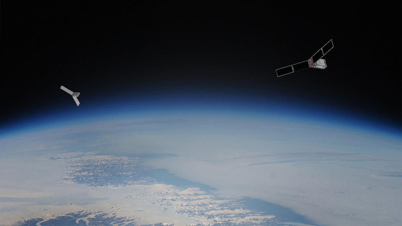 Two CubeSats, shown as an artist’s concept against an image of Earth from orbit. Two CubeSats, shown as an artist’s concept against an image of Earth from orbit.
