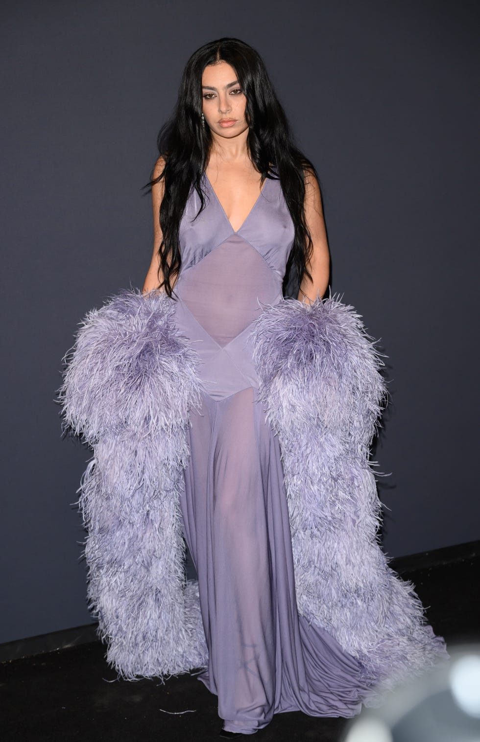 Charli XCX Attends 2025 Cannes Film Festival Event in Lilac Saint Laurent  Gown